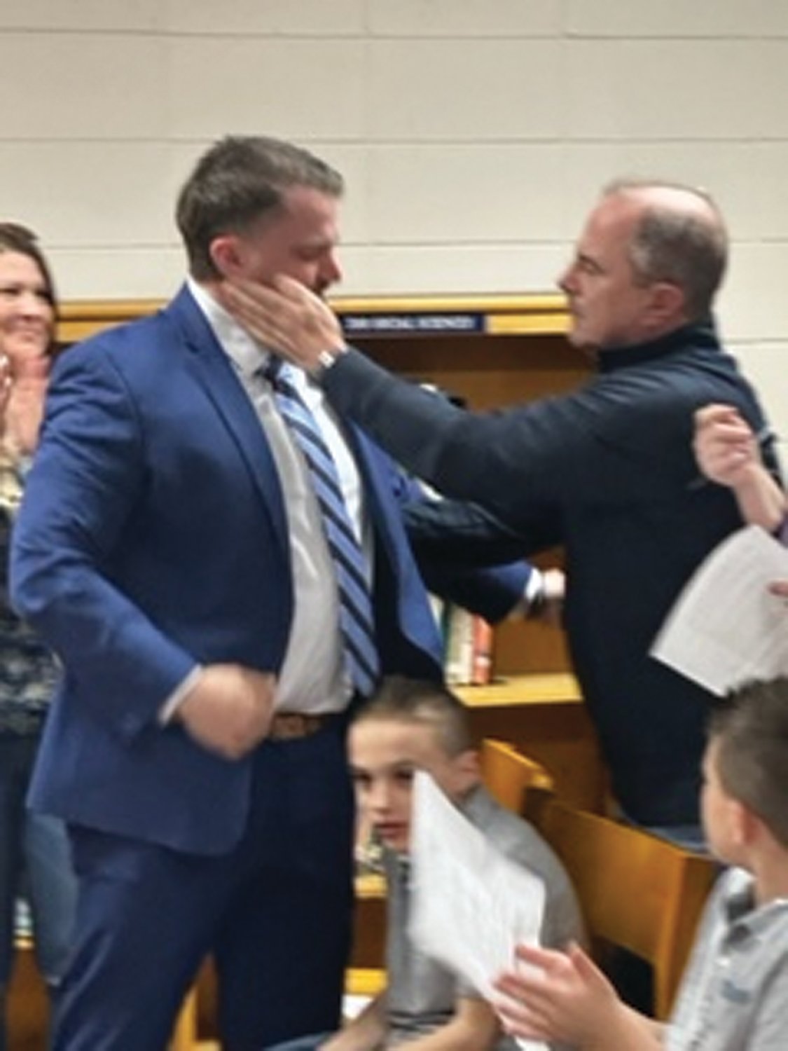 HUGS ALL AROUND: Matt Velino, the now former assistant principal at Johnston Senior High School has been promoted to the school’s top administrator post — the Principal.